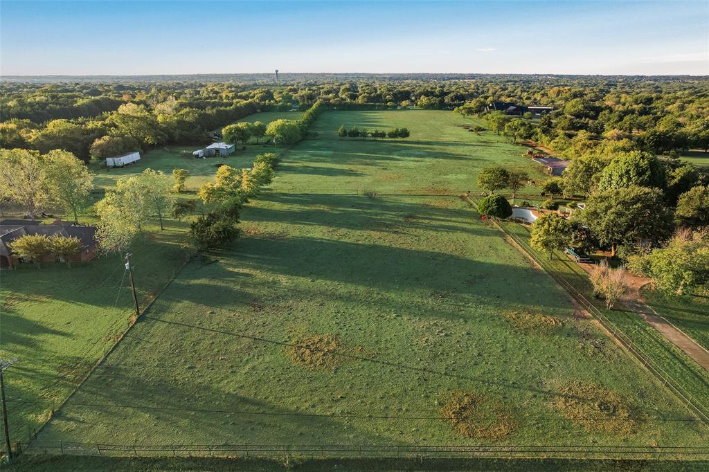 Expansive acreage featuring cleared pasture land, perimeter fencing, and mature tree clusters Expansive acreage featuring cleared pasture land, perimeter fencing, and mature tree clusters
