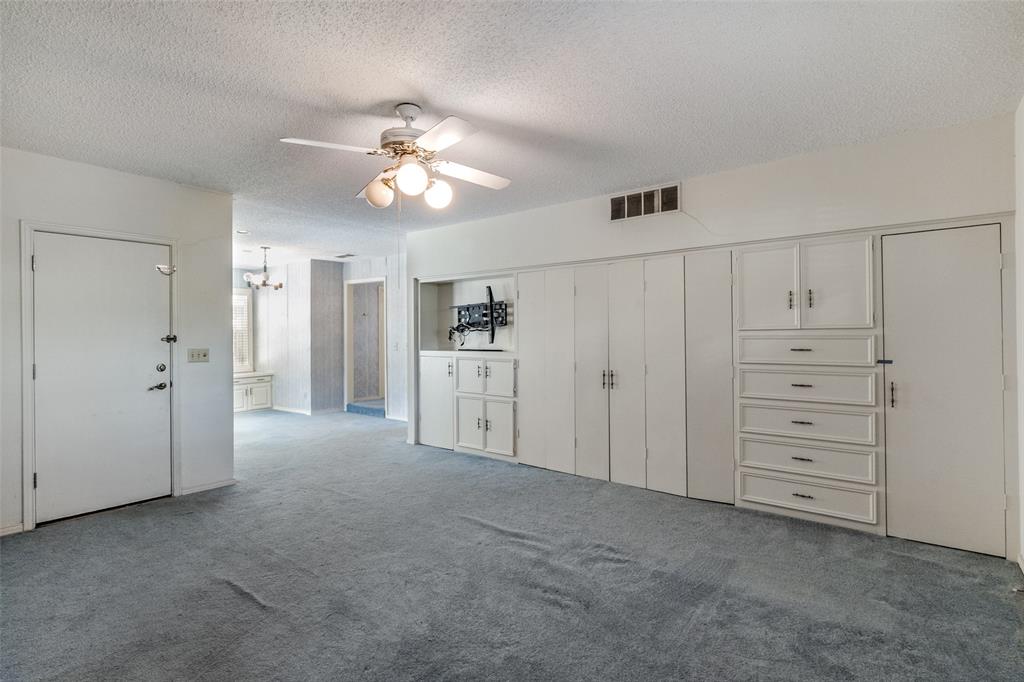 Opens to two separate bathrooms, two walk-in closets and great built-ins