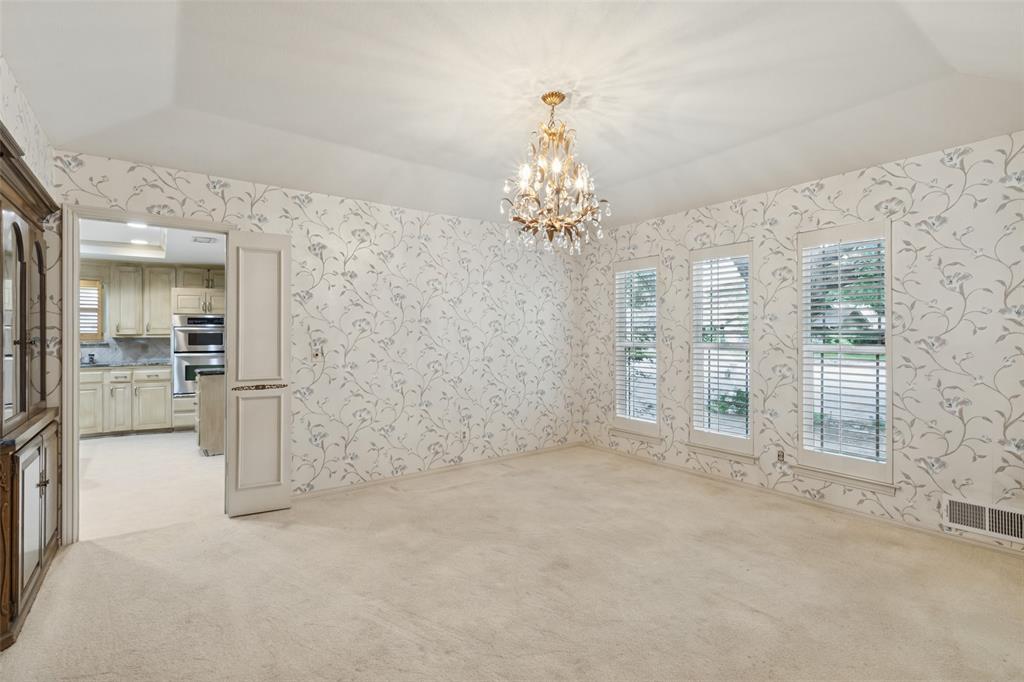 Split formal dining room with pretty chandelier