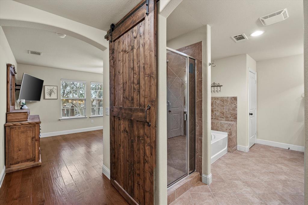Wooden barn door is only one of this home's many amenities!