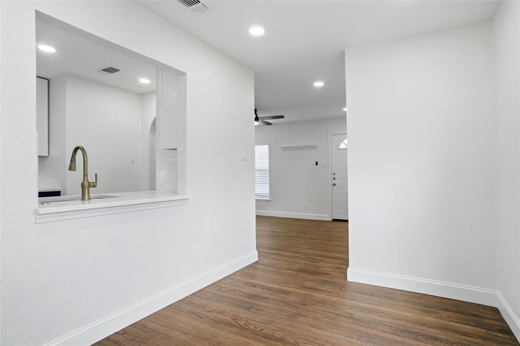 Dining room with open window to kitchen