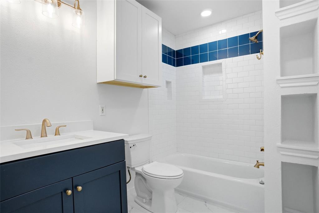 Updated primary Bath with new vanity, toilet and fixtures