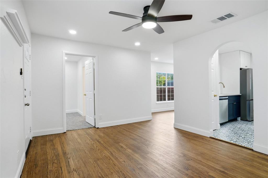 Living room leading to kitchen, dining room and primary bedroom