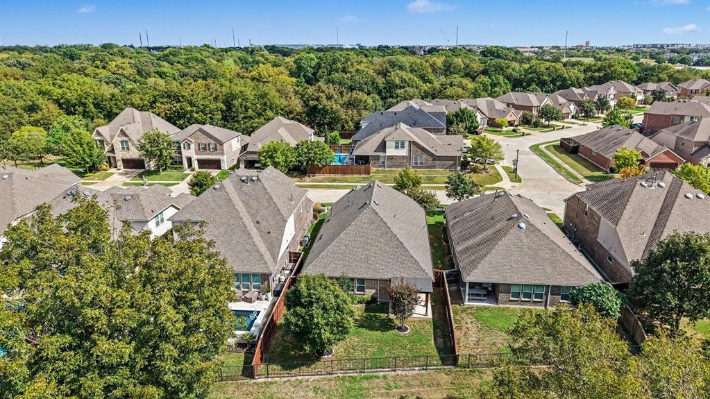 Neighborhood is surrounded by lush green trees!