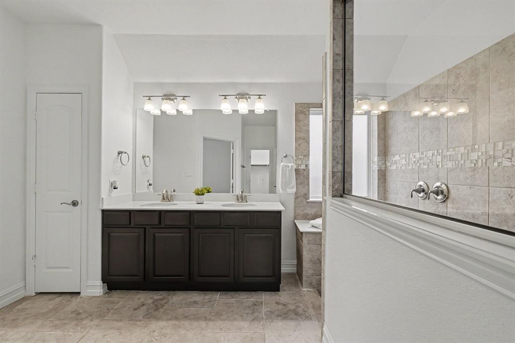 Primary bath with large walk in shower and 2, yes 2 walkin closets!