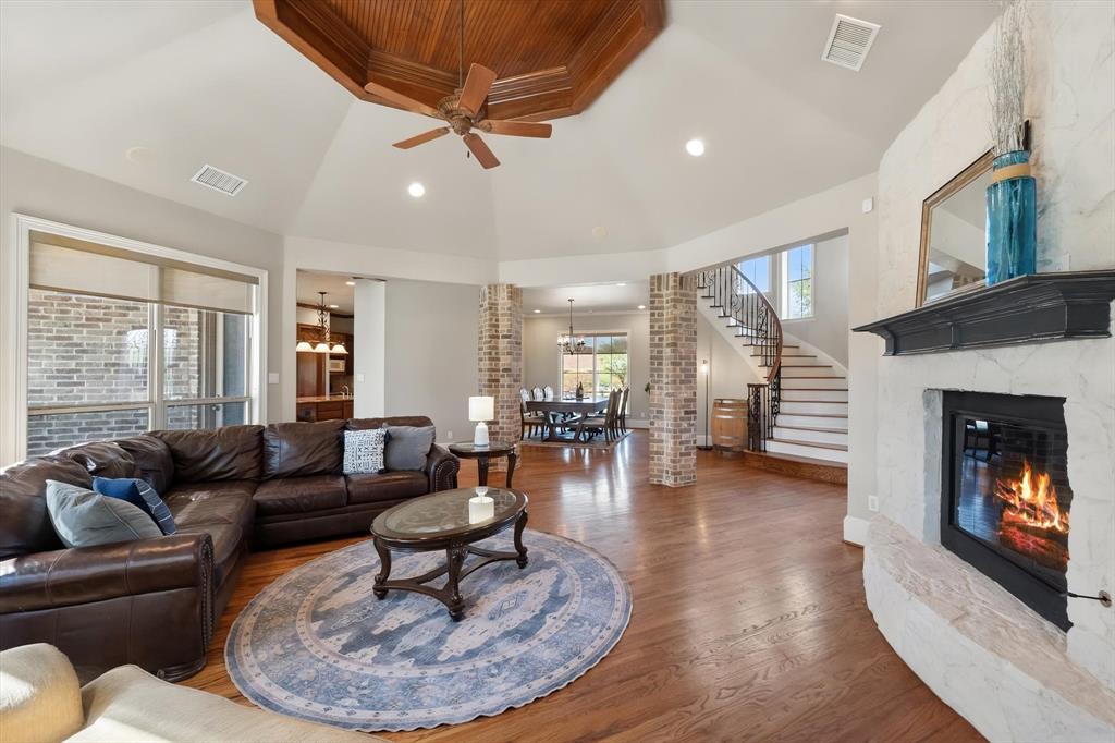 Stone fireplace and ceiling detail make this a special space