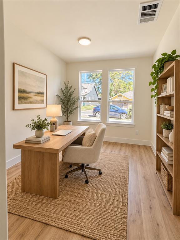 Room featuring wood-finish flooring, two dual-pane windows, and neutral wall paint