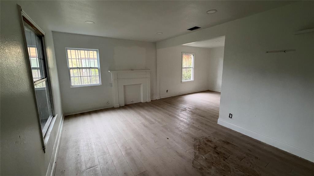 View of living room with decorative fireplace