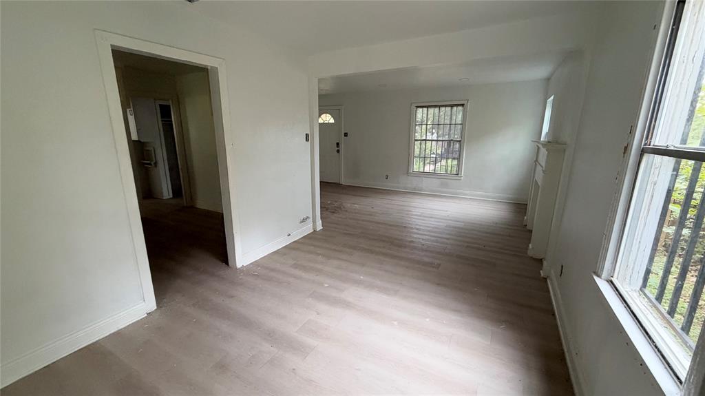 View of dining room adjacent to living room and kitchen