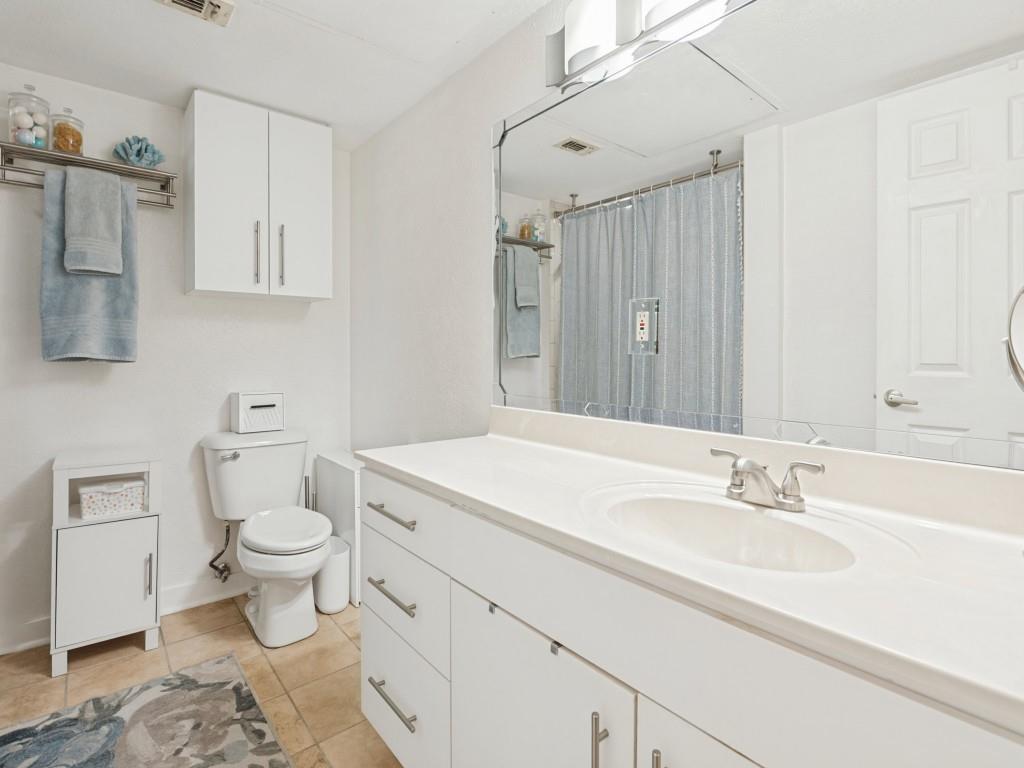 Bath with Tub Shower and oversized vanity with plenty of storage.