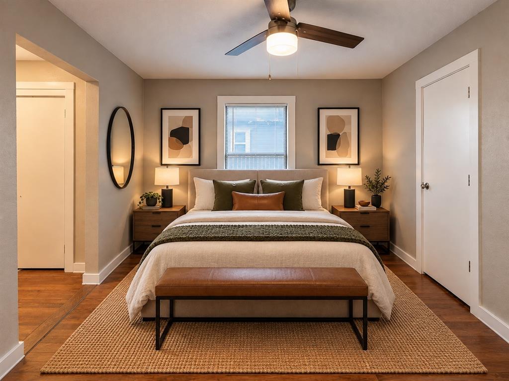 Virtually staged primary bedroom showcasing a cozy and functional furniture arrangement.