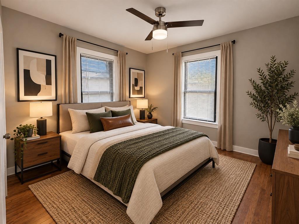Virtually staged bedroom demonstrating a comfortable sleeping area with modern decor.