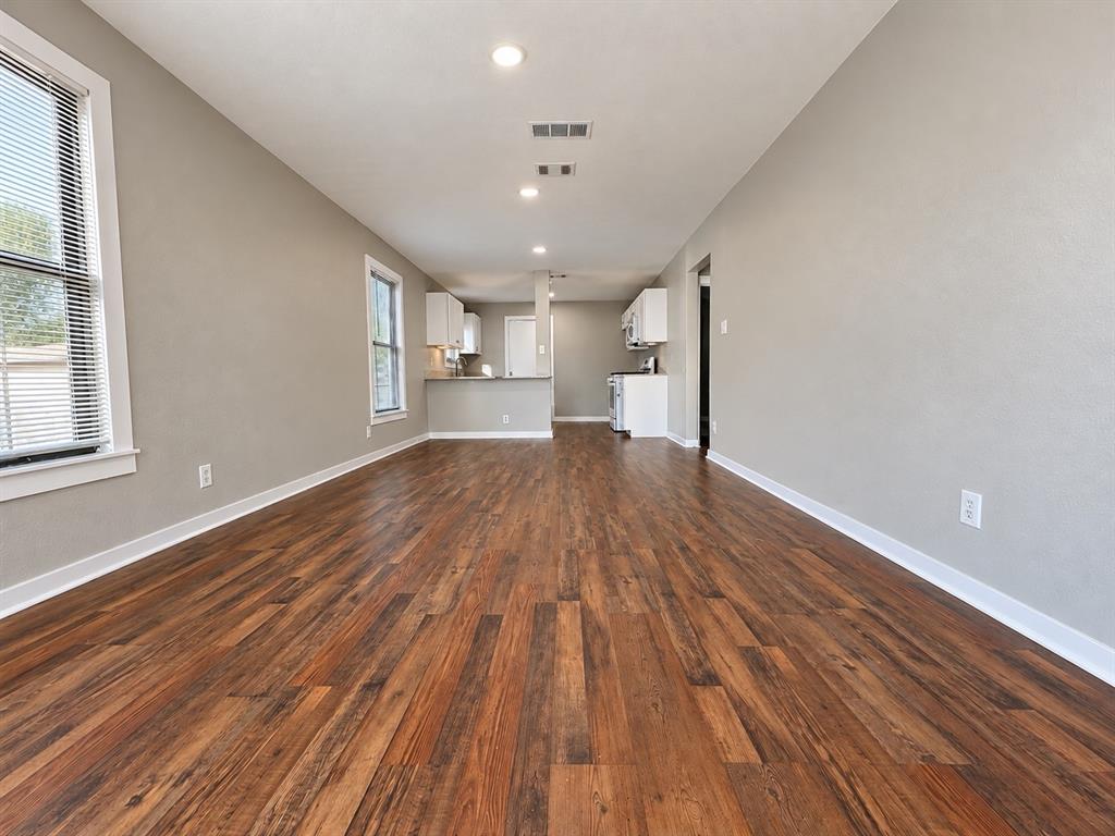 Open-concept living space featuring beautiful wood flooring and recessed lighting. Open-concept living space featuring beautiful wood flooring and recessed lighting.