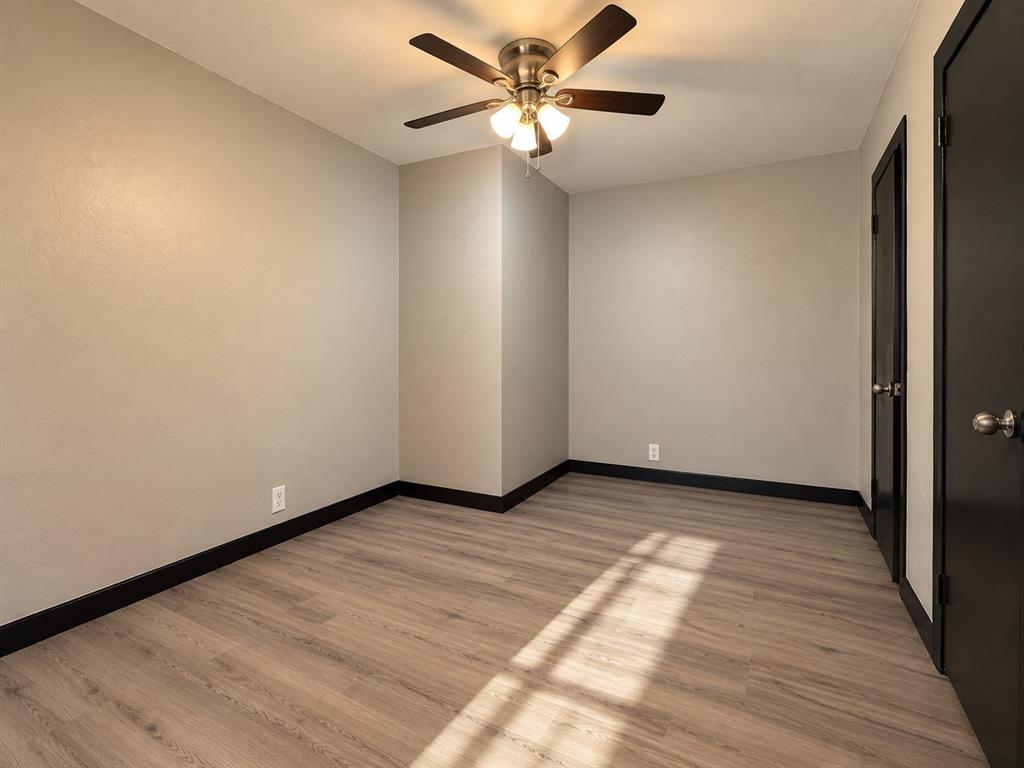 Versatile room with possibilities for a home office, study, or creative space.