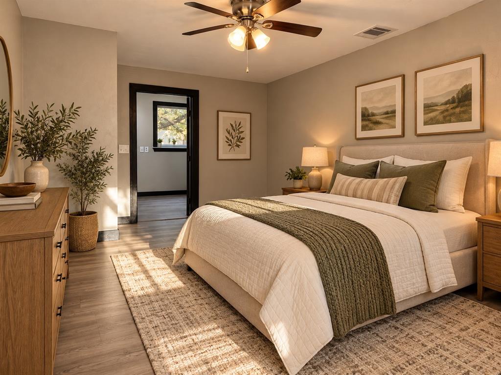 Virtually staged to highlight a comfortable bedroom arrangement and furniture possibilities.