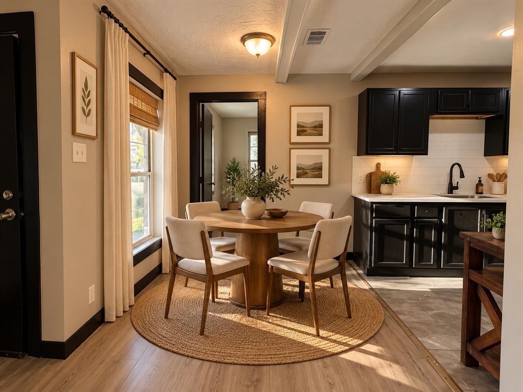 Virtually staged to illustrate a charming dining setup that makes efficient use of the space.