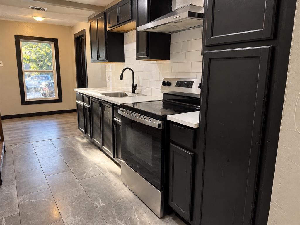 A practical kitchen layout with convenient access to the adjoining living areas.