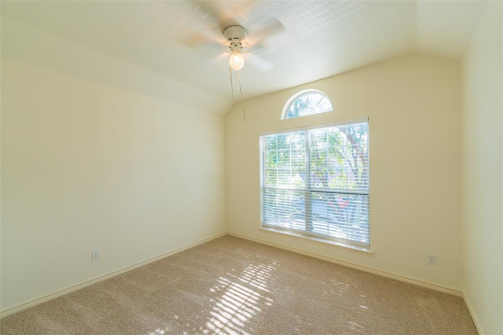 Vaulted ceiling, arched window, and overhead ceiling fan fixture