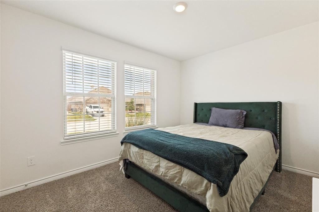 Neutral-toned interior featuring dual windows with horizontal blinds, neutral wall finish, wall-to-wall carpeting, and recessed ceiling lighting