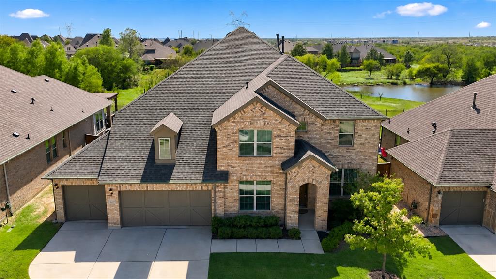 Welcome to 6417 Dolan Falls!  This home backs to a lush green space and community pond.