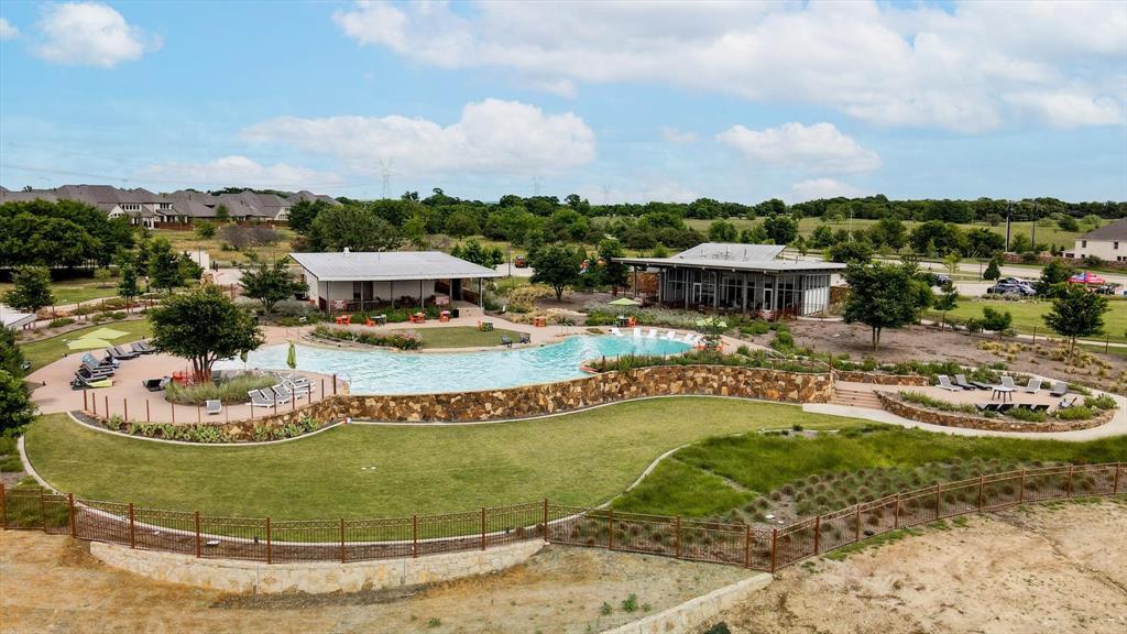 Community amenity resort style pool surrounded by lush private greenspace - a must see!