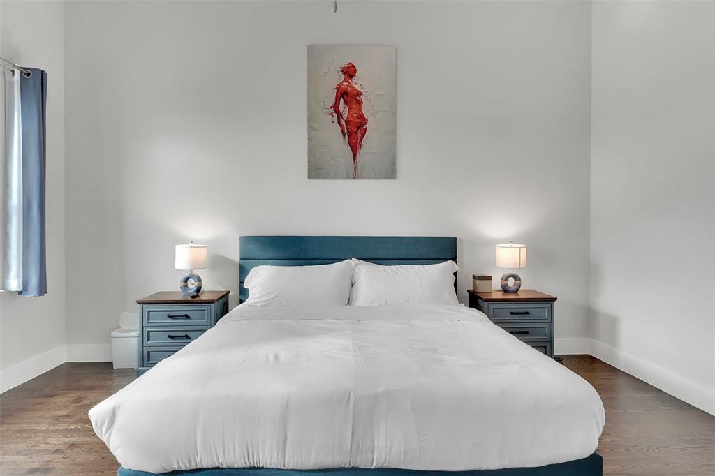 Bedroom featuring dark wood-type flooring