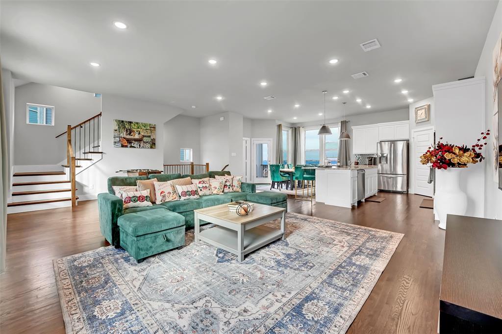 Living area featuring recessed lighting and dark wood-style flooring Living area featuring recessed lighting and dark wood-style flooring