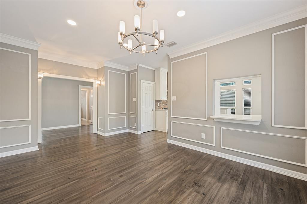 This dining area provides space for large or small gatherings and has a handy passthrough to the kitchen.