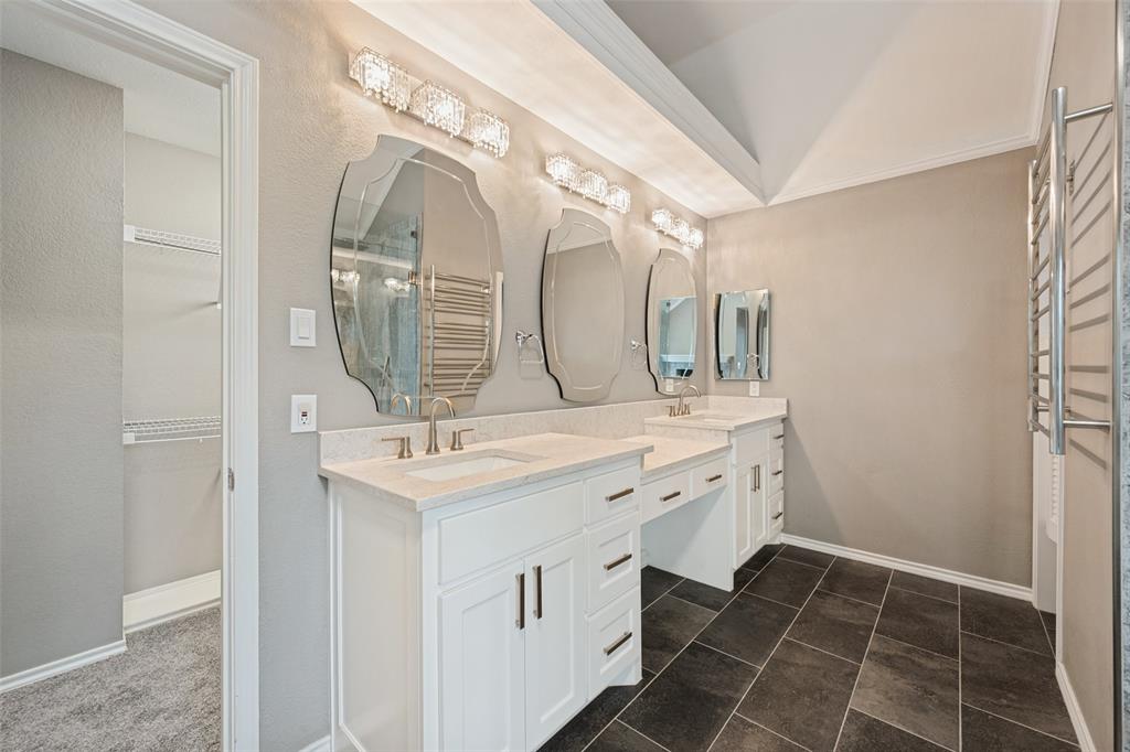 Beautiful mirrors grace the double sink dressing vanity.