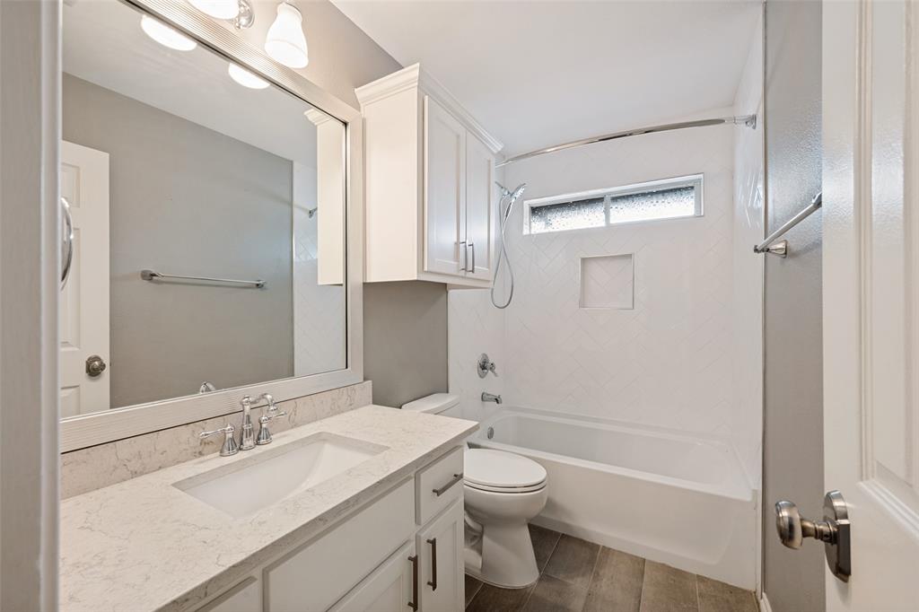 This bathroom sits between 2 bedrooms on the south side of the house. It has a motion sensor on a switch which turns on a tiny light to illuminate the room during those late night trips to the bathroom.