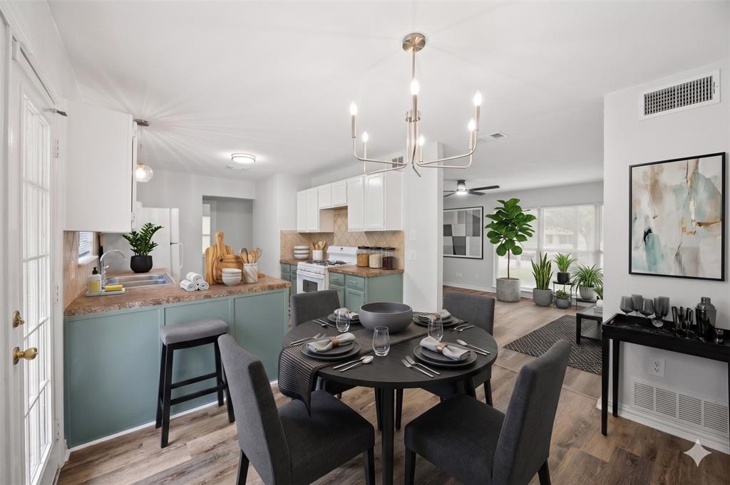 AI IMAGINED - Open-concept living space featuring wood-finish flooring and a contemporary chandelier