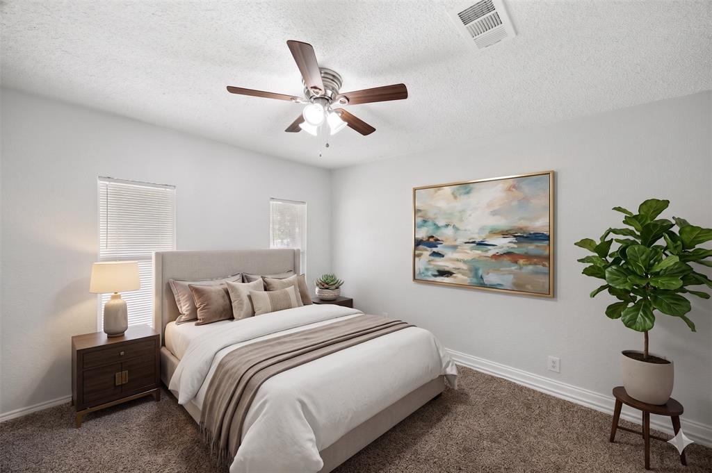 AI IMAGINED - Carpeted bedroom featuring a ceiling fan with light fixture, two windows with blinds, and white baseboards