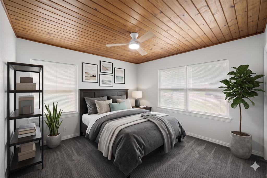 AI IMAGINED - Wood paneled ceiling with a central ceiling fan fixture, accompanied by light gray walls and dark gray patterned carpeting