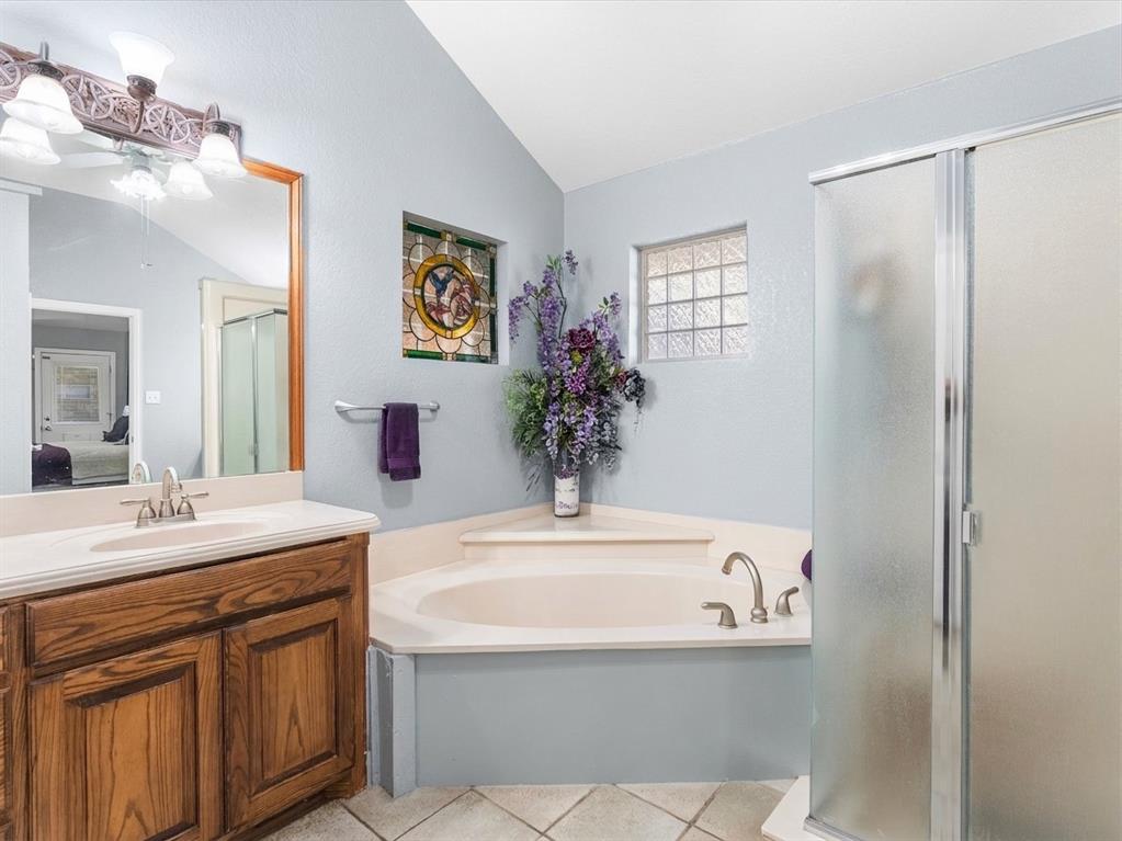 Primary bathroom with garden tub and separate shower