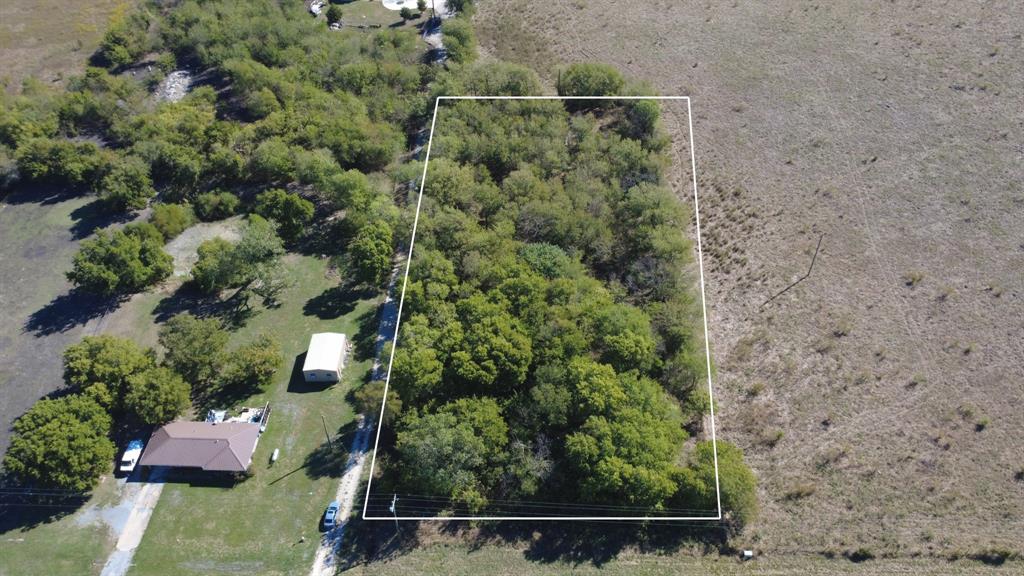 Expansive parcel of land featuring dense tree coverage and established vegetation