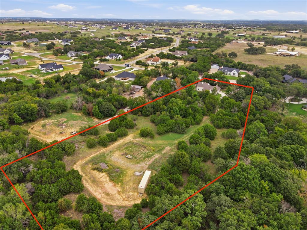 Expansive acreage featuring mature trees, natural terrain, and established vegetation