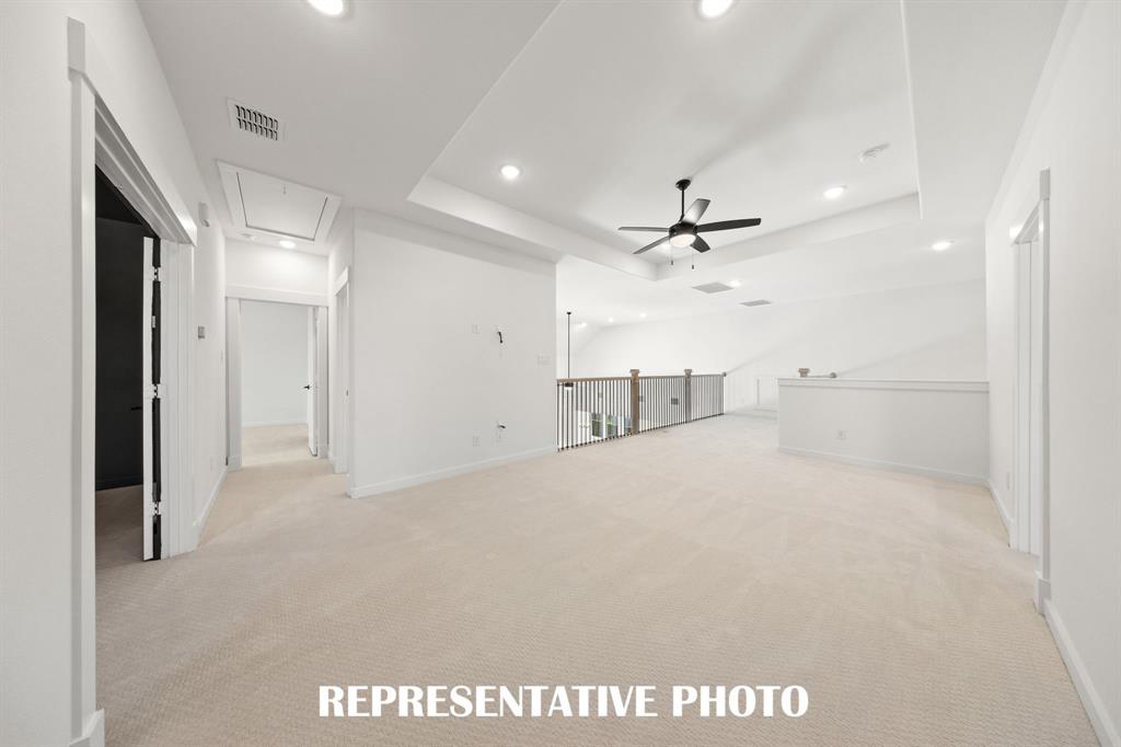 Light and bright, the family will love getting together for game night in this wonderful game room!  REPRESENTATIVE PHOTO