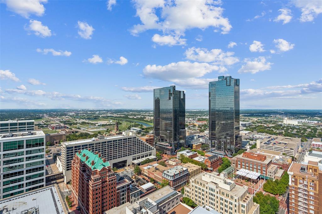 Panoramic urban skyline backdrop featuring prominent high-rise architecture and expansive city horizon
