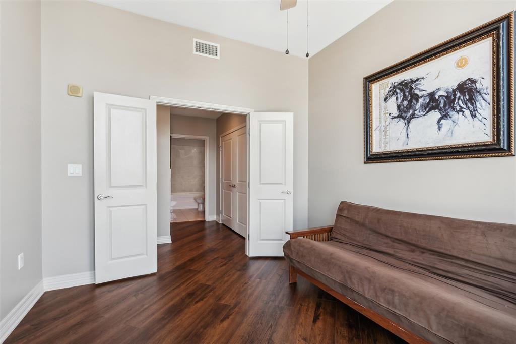 Vaulted ceilings, wood-finish flooring, two-panel interior doors, and neutral wall tones