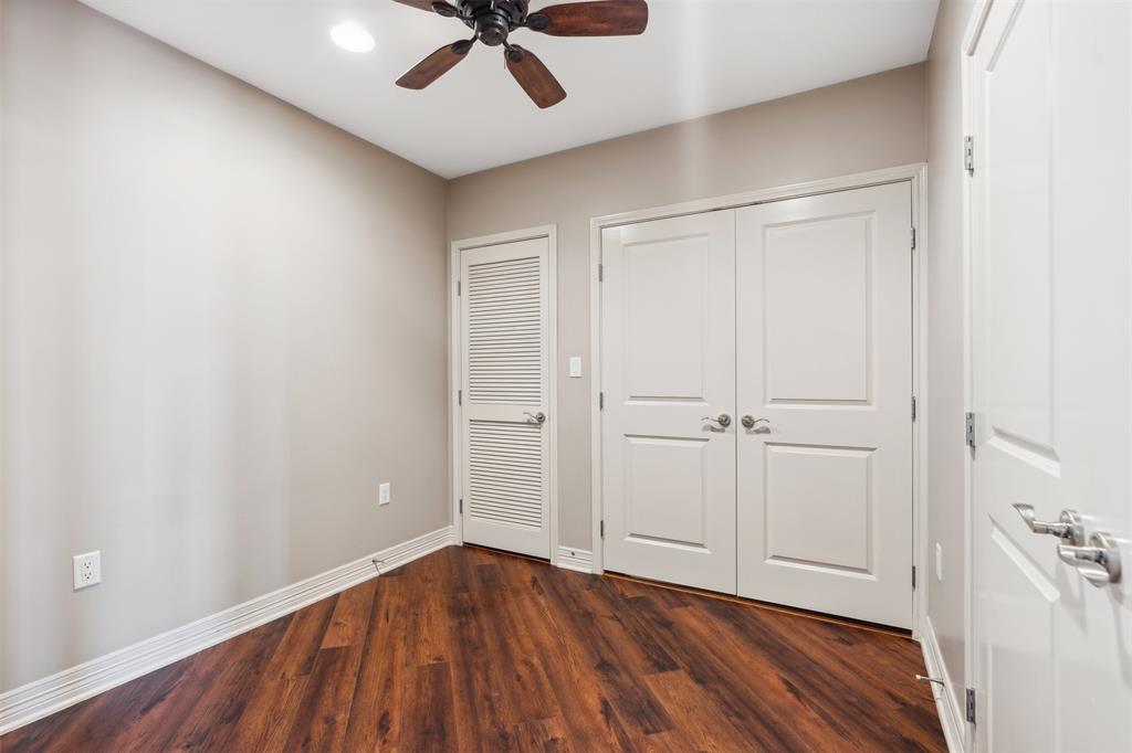 Room featuring wood-finish flooring, recessed lighting, ceiling fan, louvered closet door, and dual-panel interior doors