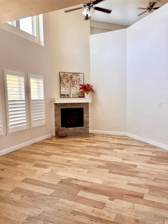 Downstairs Living w gas fireplace, custom extra-wide shutters