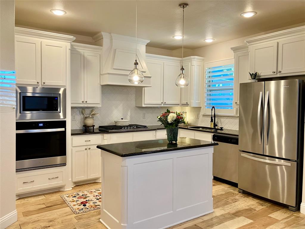 New oven, paint throughout incl cabinets, sanded wood floors