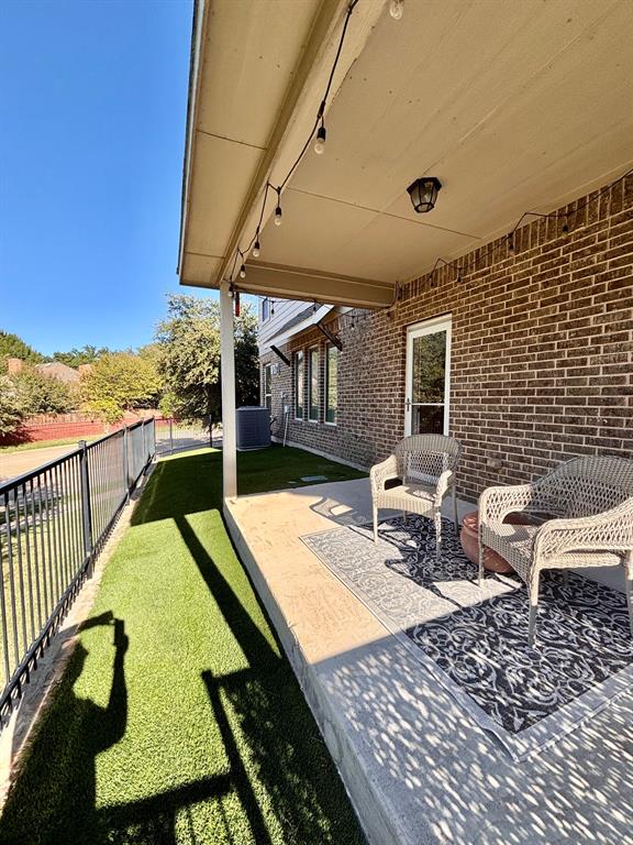 Wrap around covered patio w yard below