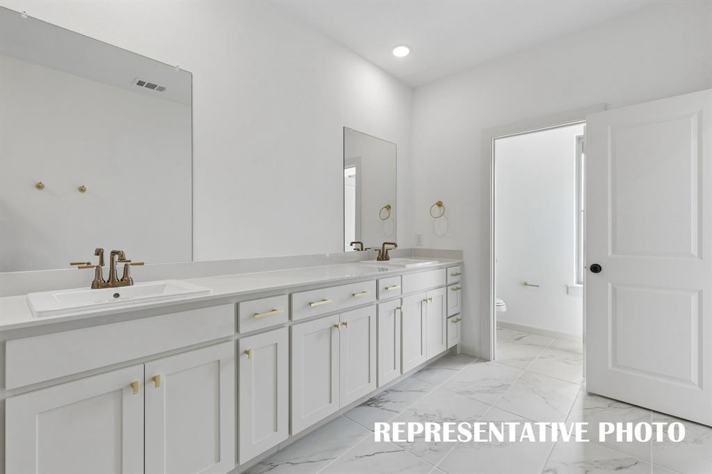 You'll find ample space for two in this wonderful owner's bath.  REPRESENTATIVE PHOTO
