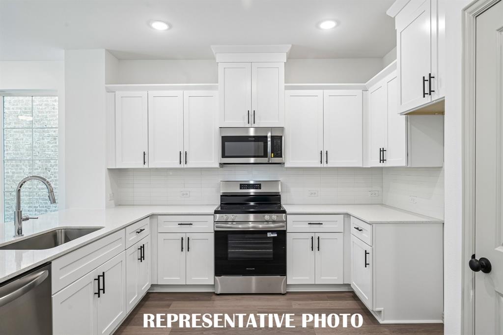 You'll find ample storage and prep space in this delightful kitchen!  REPRESENTATIVE PHOTO