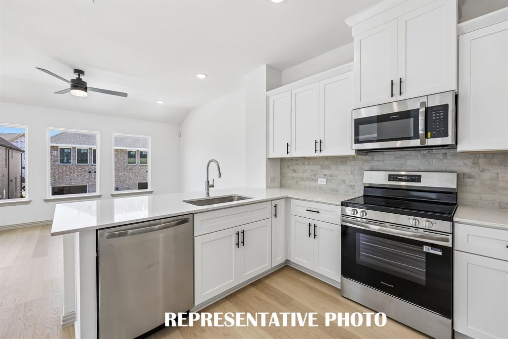 The chef will never be left out of the party in this charming open concept floor plan.  REPRESENTATIVE PHOTO