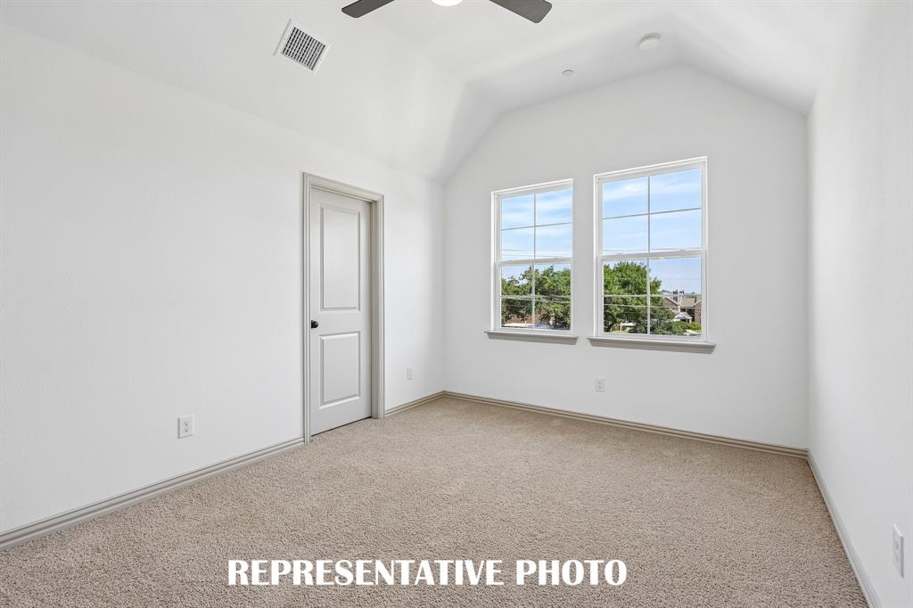 With high ceilings, oversized windows and plush carpeting, this owner's bedroom was designed for rest and relaxation.  REPRESENTATIVE PHOTO
