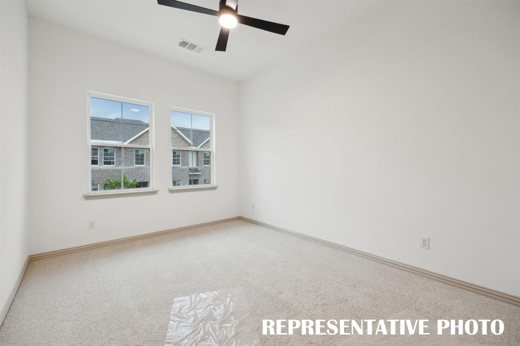 This light, bright owner's bedroom is the perfect place to relax and unwind at the end of the day.  REPRESENTATIVE PHOTO