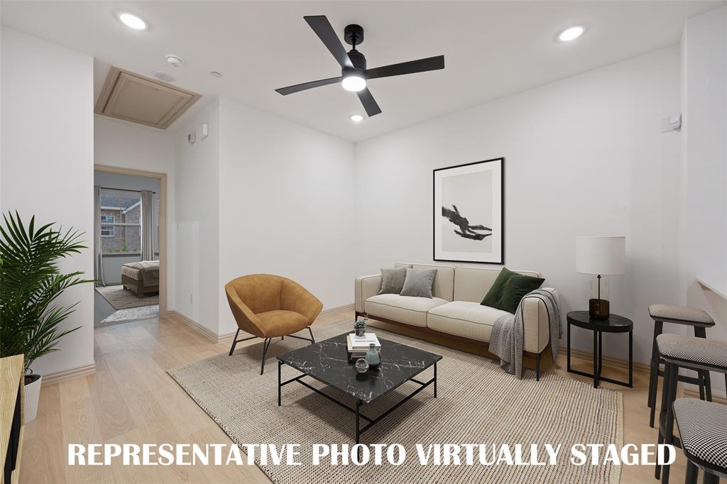 This fantastic family room is ready for all your entertaining needs!  REPRESENTATIVE PHOTO VIRTUALLY STAGED