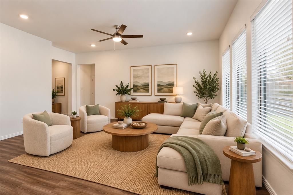 Living area featuring wood-finish flooring, recessed lighting, a modern ceiling fan, and large windows with horizontal blinds. Virtual photo